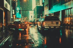 white car on wet asphalt road