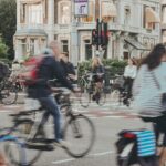 people riding bicycle on road during daytime